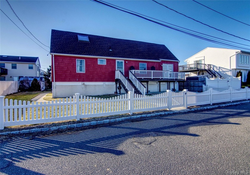 Welcome to this charming raised Cape in Seaford with canal - Beach Home for sale in Seaford, New York on Beachhouse.com