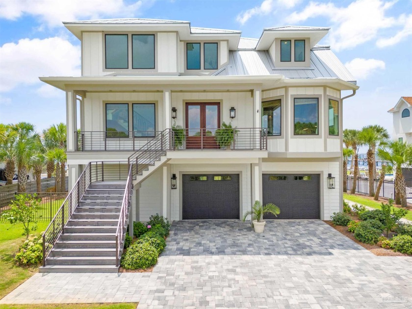 Experience unparalleled luxury in this custom-built 4,000 sq. ft - Beach Home for sale in Gulf Breeze, Florida on Beachhouse.com