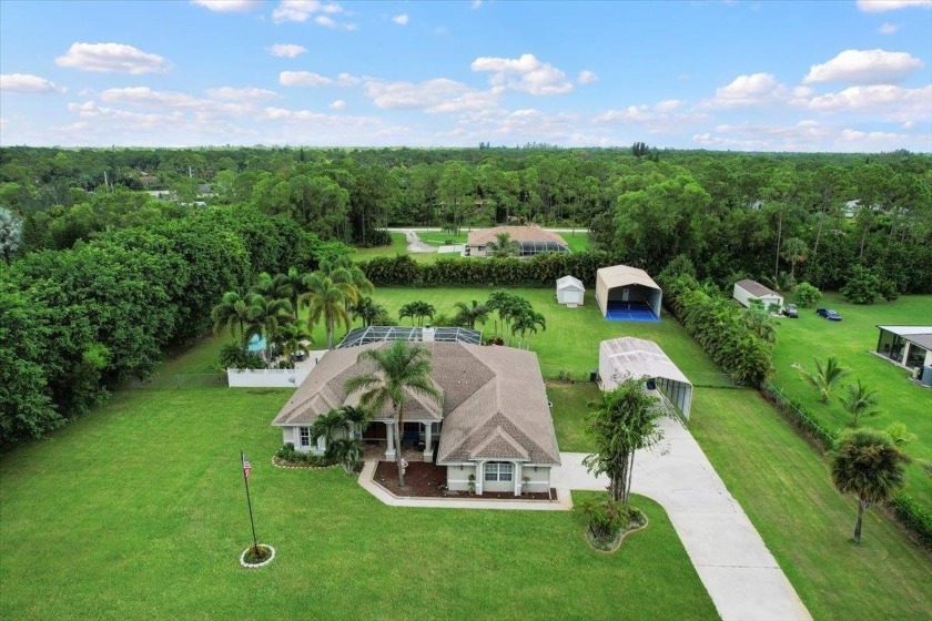 Spacious open floor plan 3/2 Pool Home on approx 1.5 acre in - Beach Home for sale in West Palm Beach, Florida on Beachhouse.com