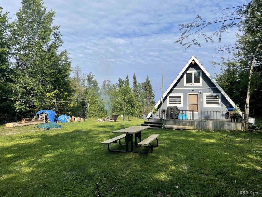 The ultimate lakeside getaway! On 9.3 acres, this home includes - Beach Home for sale in Manistique, Michigan on Beachhouse.com