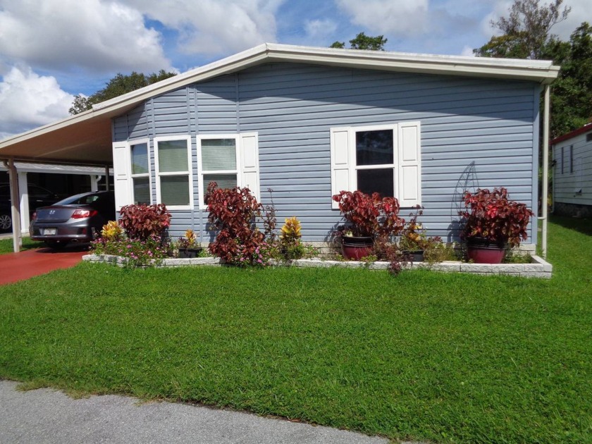 THIS IS A LOVELY HOME ON A GREAT LOT WITH A POND VIEW IN THE - Beach Home for sale in New Port Richey, Florida on Beachhouse.com