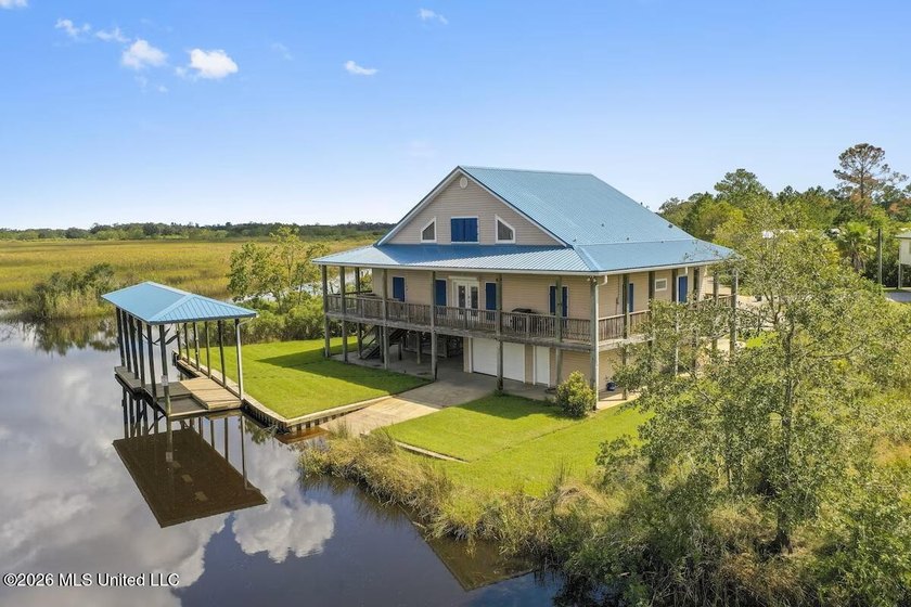 Waterfront, fully furnished, and turnkey - this Bay St. Louis - Beach Home for sale in Bay Saint Louis, Mississippi on Beachhouse.com