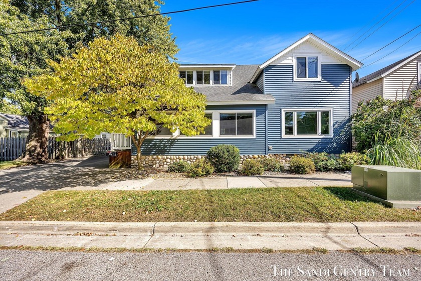 Beautifully remodeled and offering over 2,600 sq ft, this - Beach Home for sale in Grand Haven, Michigan on Beachhouse.com