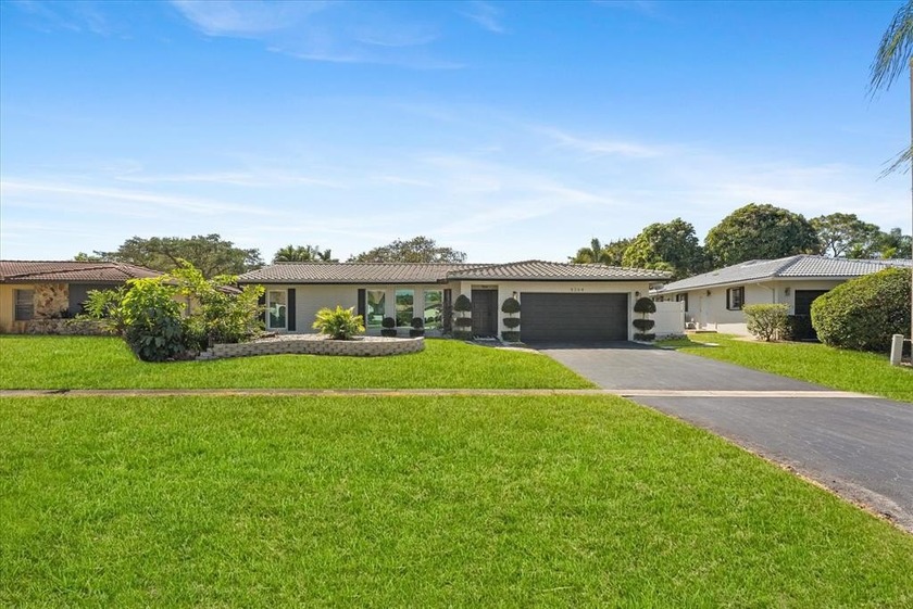 Simply beautiful, updated waterfront home with ALL IMPACT - Beach Home for sale in Coral Springs, Florida on Beachhouse.com