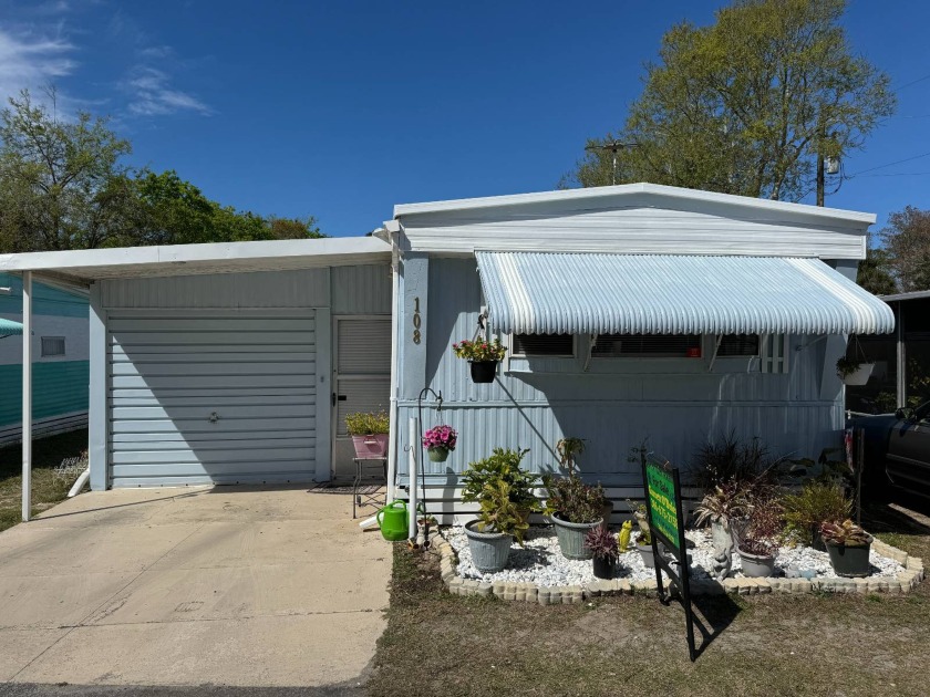 Garage home with a spacious shed/workshop area located in - Beach Home for sale in Ormond Beach, Florida on Beachhouse.com