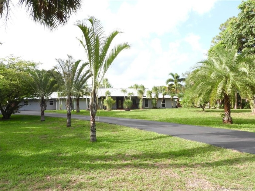 Country elegance & modern comfort on this beautiful 5-acre Palm - Beach Home for sale in Palm City, Florida on Beachhouse.com