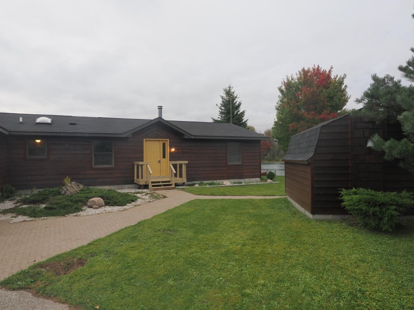 This single story St Marys river home is well located just 3 - Beach Home for sale in Sault Sainte Marie, Michigan on Beachhouse.com