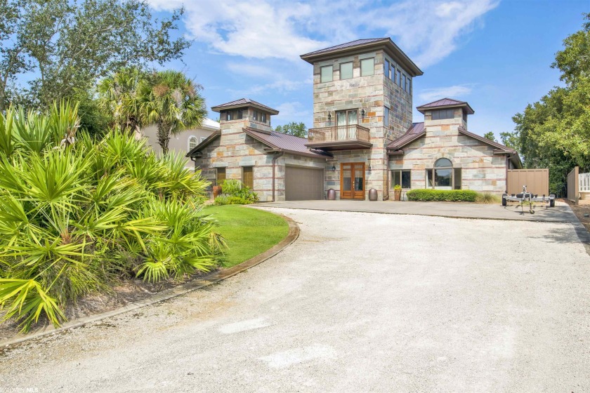 Gorgeous canal front home with a master bedroom with a - Beach Home for sale in Orange Beach, Alabama on Beachhouse.com