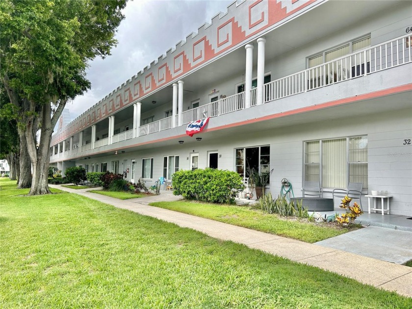 This colorful first-floor, one bed/one bath unit is situated - Beach Condo for sale in Clearwater, Florida on Beachhouse.com