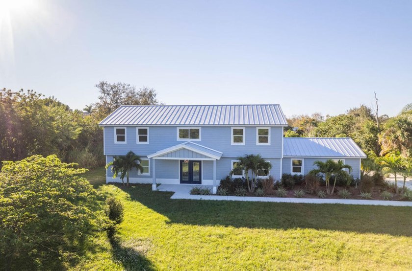Where modern elegance meets timeless farmhouse charm! Set on - Beach Home for sale in Fort Pierce, Florida on Beachhouse.com