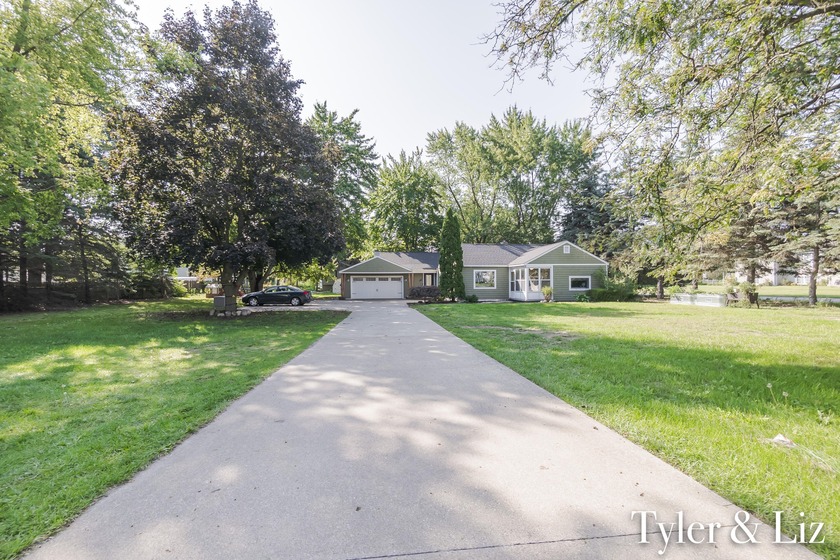 Welcome to this beautifully updated 4-bedroom, 2-bathroom home - Beach Home for sale in Holland, Michigan on Beachhouse.com