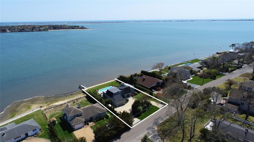 Nestled along Tiana Bay, this exceptional waterfront property in - Beach Home for sale in Hampton Bays, New York on Beachhouse.com