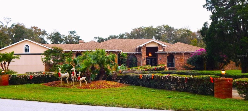 This INCREDIBLE, almost 4000 sq. ft.  brick concrete home, with - Beach Home for sale in New Port Richey, Florida on Beachhouse.com