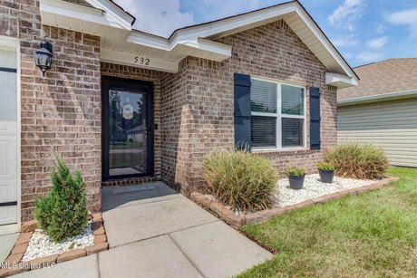 This delightful four-bedroom, brick home is nestled on a - Beach Home for sale in Long Beach, Mississippi on Beachhouse.com