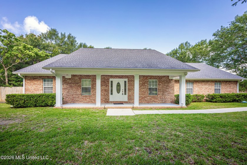 Welcome home to this spacious 3-bedroom, 2-bath brick home - Beach Home for sale in Ocean Springs, Mississippi on Beachhouse.com