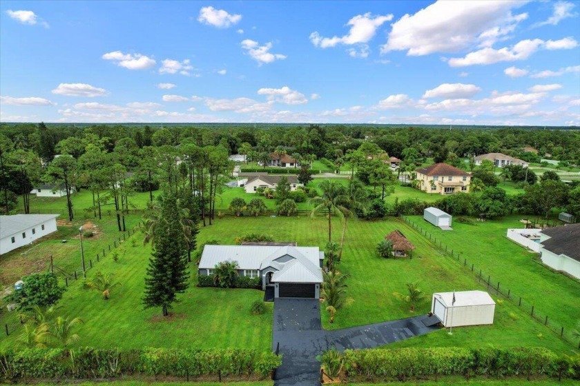 Welcome to your dream homestead in The Acreage! Nestled on a - Beach Home for sale in West Palm Beach, Florida on Beachhouse.com