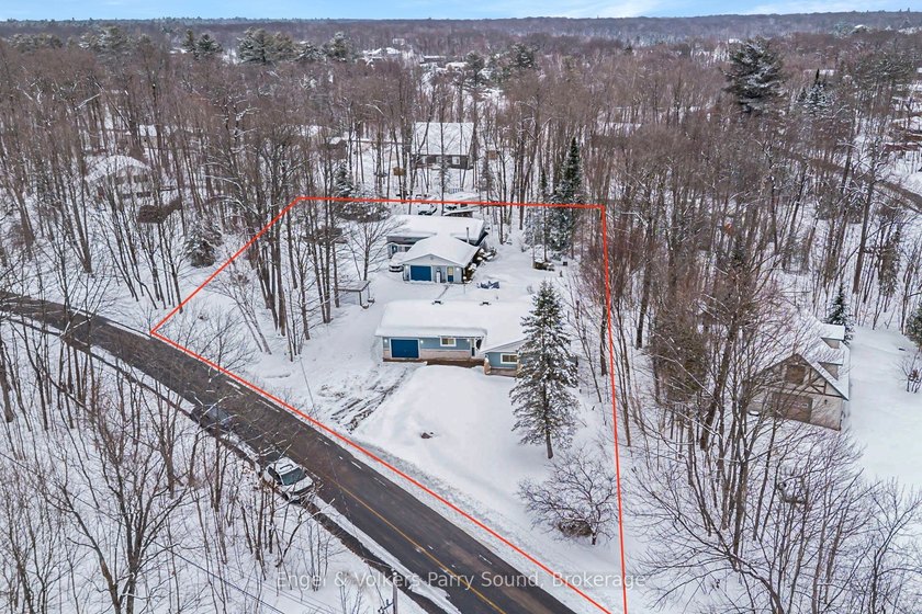 Set on a beautifully treed double-wide lot allowing for shady - Beach Home for sale in Mcdougall, Ontario on Beachhouse.com