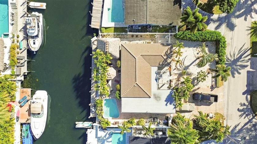 Located in prestigious Pompano Shores, this waterfront pool home - Beach Home for sale in Pompano Beach, Florida on Beachhouse.com