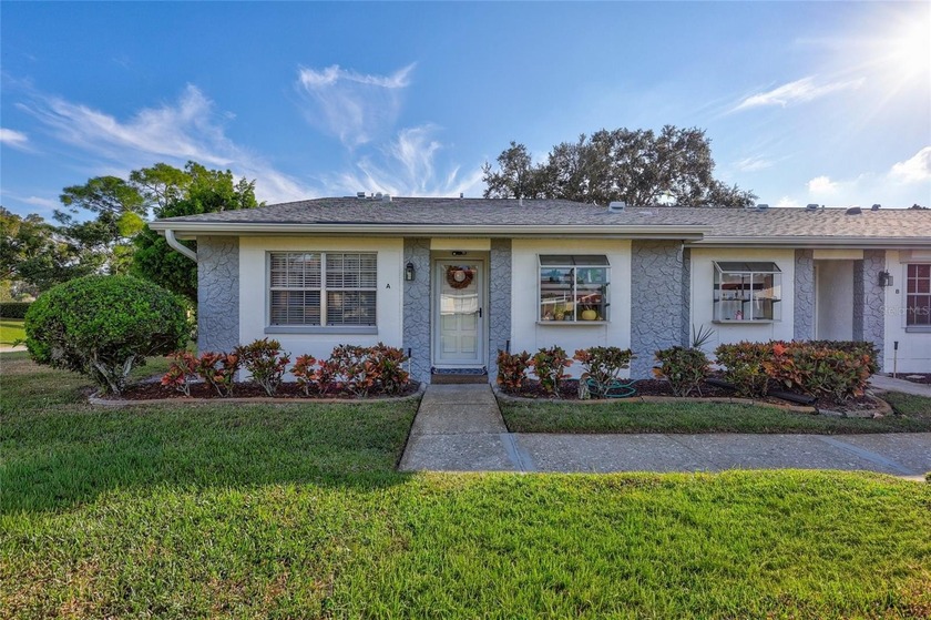 Welcome to this beautifully updated two-bedroom villa in highly - Beach Home for sale in Palm Harbor, Florida on Beachhouse.com