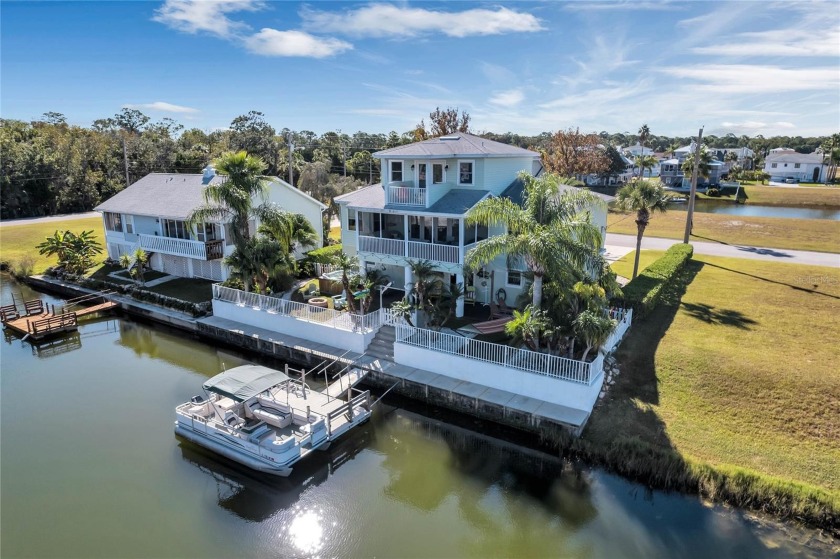 Experience true waterfront living. This 3 story home features - Beach Home for sale in Hernando Beach, Florida on Beachhouse.com