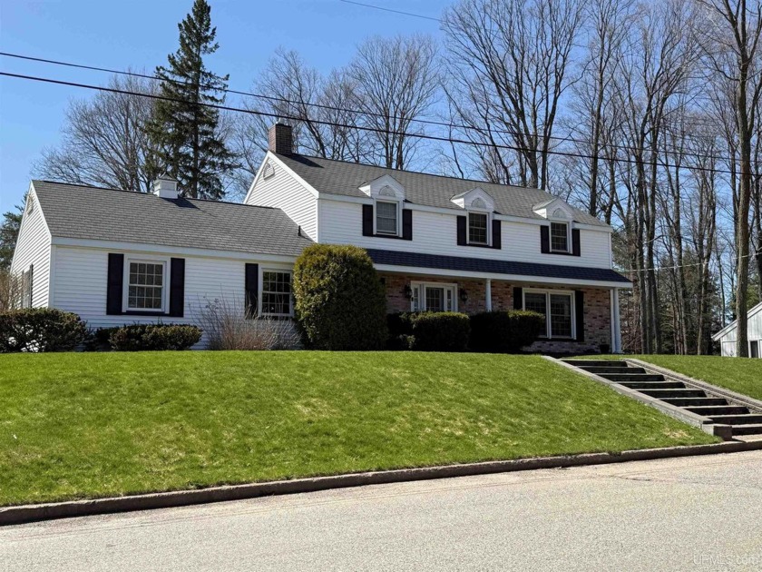This beautifully maintained, custom-built Colonial home blends - Beach Home for sale in Marquette, Michigan on Beachhouse.com