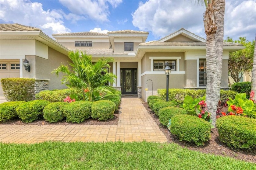 Prepare to fall in love with this stunning home nestled in the - Beach Home for sale in Lakewood Ranch, Florida on Beachhouse.com