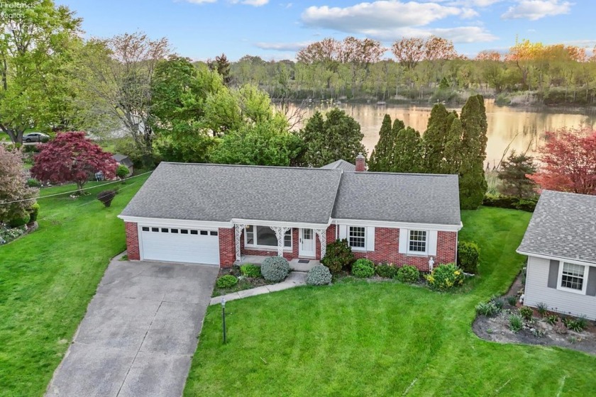 WATERFRONT! This brick ranch with incredible water views is the - Beach Home for sale in Sandusky, Ohio on Beachhouse.com