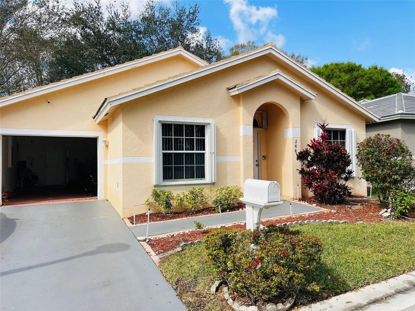 Beautiful and well-maintained home located in a desirable gated - Beach Home for sale in Greenacres, Florida on Beachhouse.com