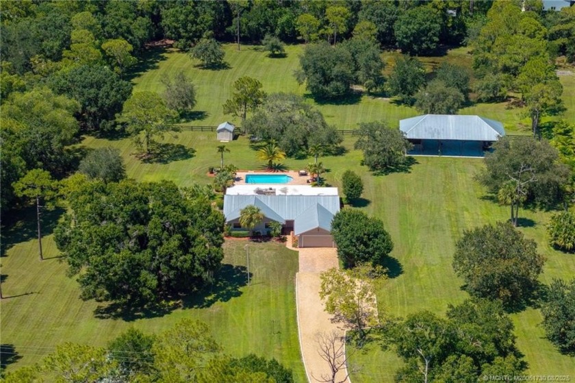 Welcome to this well-cared for 4BR/2BA home w/ extensive outdoor - Beach Home for sale in Palm City, Florida on Beachhouse.com