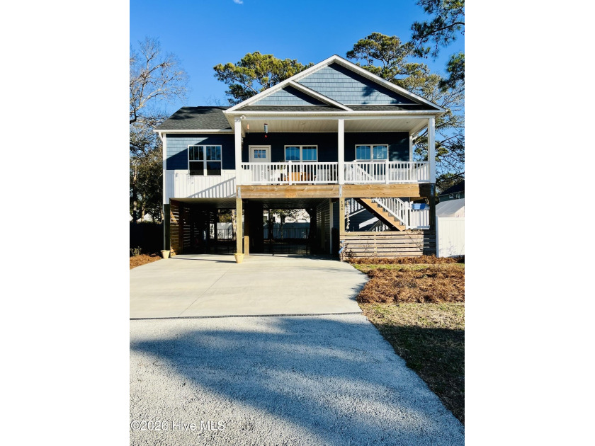 Coastal comfort meets functional design in this 3-bedroom - Beach Home for sale in Oak Island, North Carolina on Beachhouse.com