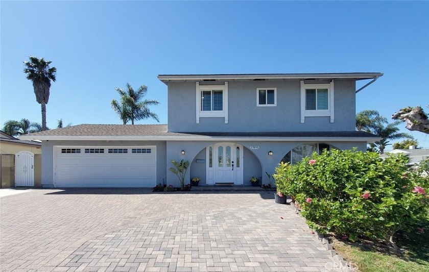 Beautifully remodeled two-story home in a corner lot which - Beach Home for sale in Huntington Beach, California on Beachhouse.com