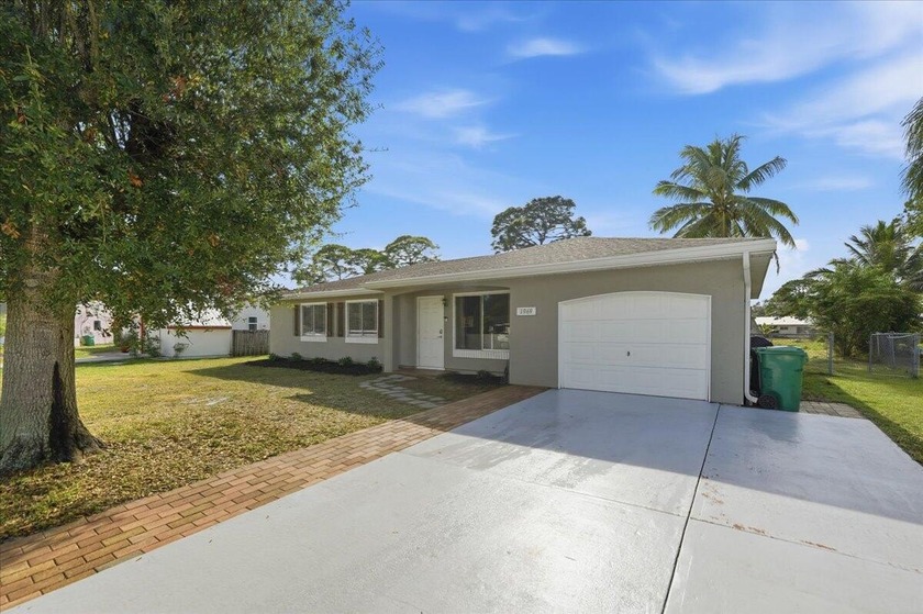 Come check out this 5-bedroom 2 bath home today perfect for the - Beach Home for sale in Port Saint Lucie, Florida on Beachhouse.com