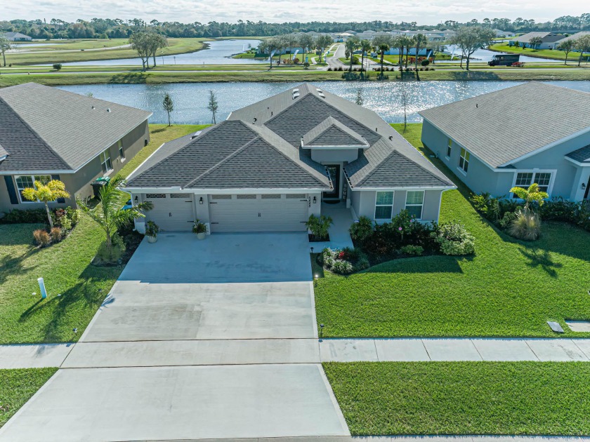 Exceptional 4 Bed/3 car garage lake front home boasts a myriad - Beach Home for sale in Fort Pierce, Florida on Beachhouse.com