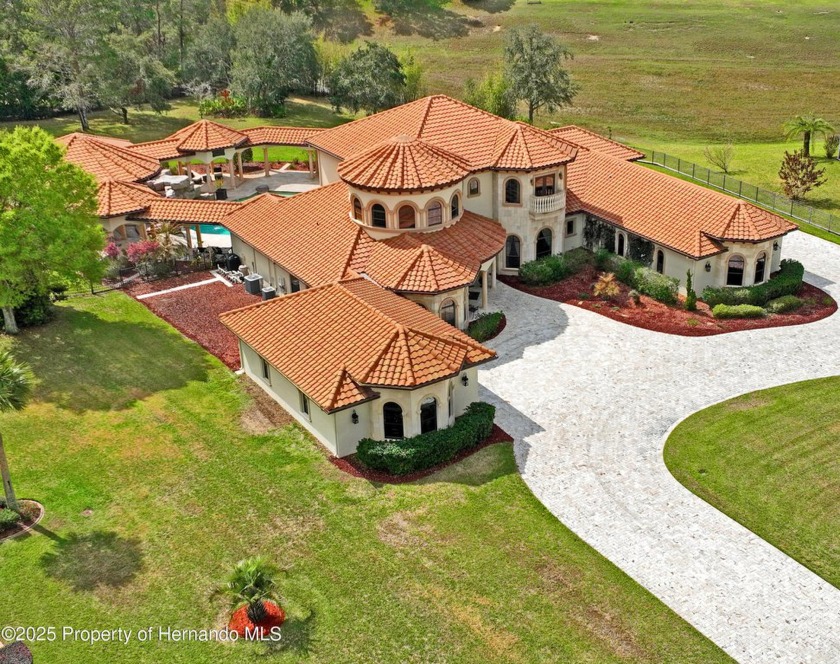 This  Mediterranean inspired, resort-themed home sits on a quiet - Beach Home for sale in Weeki Wachee, Florida on Beachhouse.com