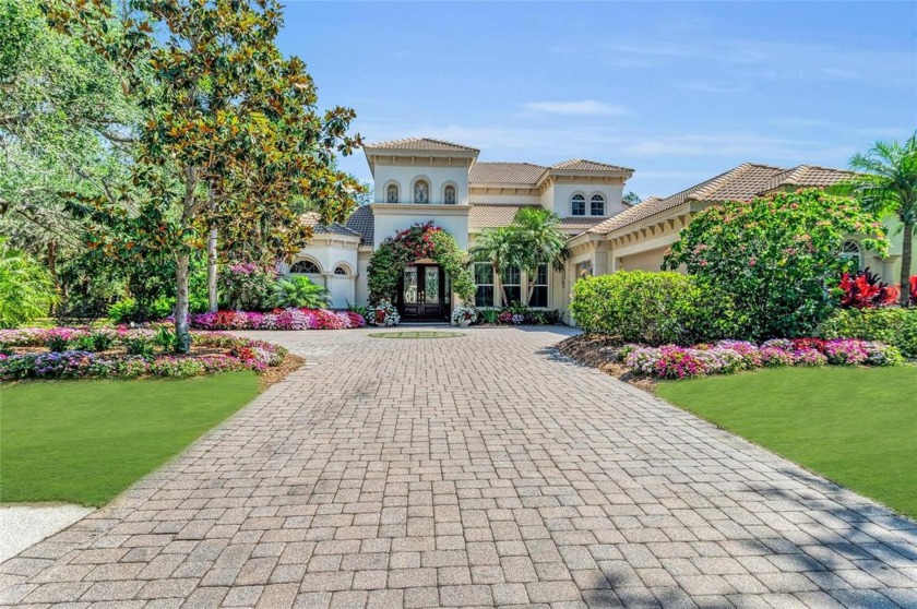 Experience the pinnacle of refined Florida living in this - Beach Home for sale in University Park, Florida on Beachhouse.com