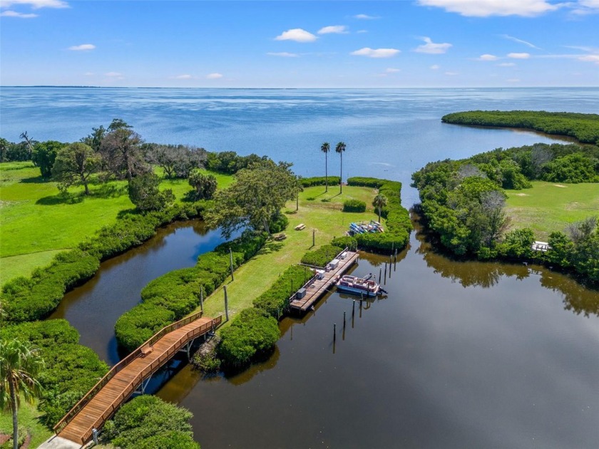 Arrive through the secure entry gates of Gulf Front Lagoon to - Beach Condo for sale in Tarpon Springs, Florida on Beachhouse.com