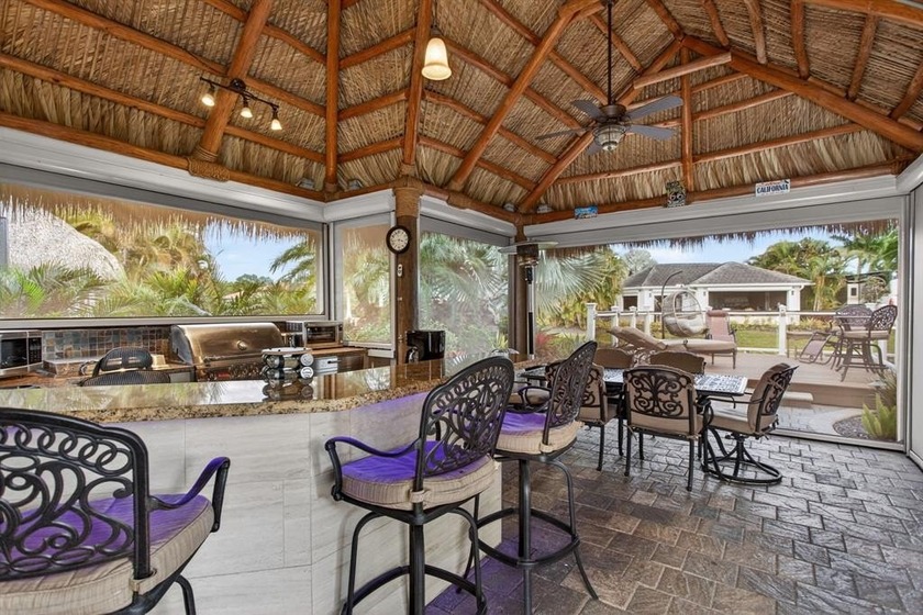 Waterfront tiki property featuring a spacious tiki hut with - Beach Condo for sale in Margate, Florida on Beachhouse.com