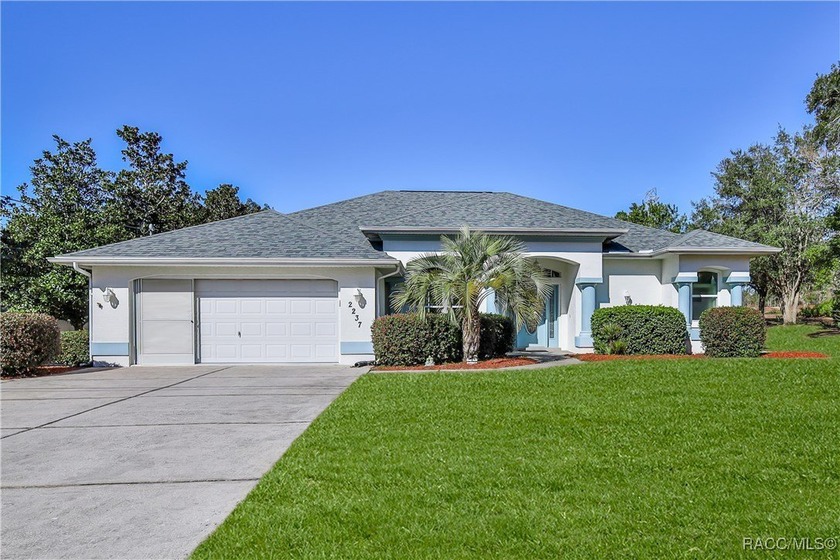 Set on a beautifully landscaped half-acre lot with mature palm - Beach Home for sale in Spring Hill, Florida on Beachhouse.com