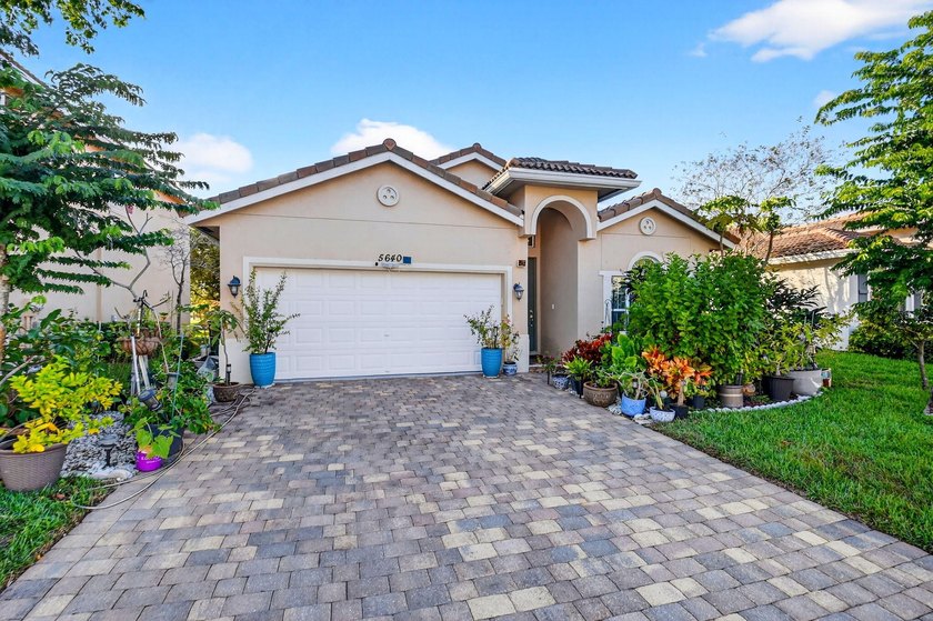 Welcome to this meticulously maintained, single-owner home! This - Beach Home for sale in Greenacres, Florida on Beachhouse.com