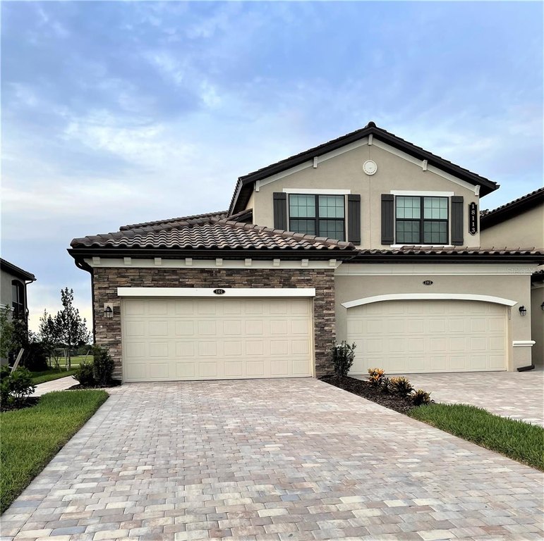 This gorgeous TURNKEY, FULLY FURNISHED Coach Home is situated on - Beach Condo for sale in Lakewood Ranch, Florida on Beachhouse.com