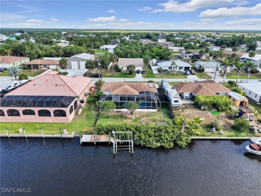 Saltwater POOL HOME on SAILBOAT waterway with DOCK and Boat - Beach Home for sale in Port Charlotte, Florida on Beachhouse.com