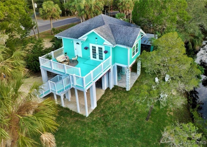 This cozy Tiffany blue stilted retreat is a fully functioning - Beach Home for sale in Crystal River, Florida on Beachhouse.com
