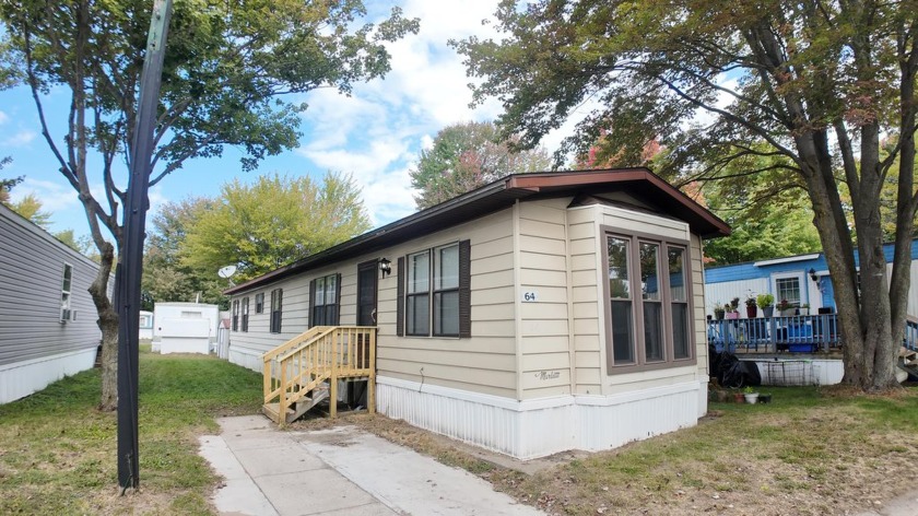 Welcome to 1281 E Pontaluna Rd, Lot 64 in the peaceful Pontaluna - Beach Home for sale in Norton Shores, Michigan on Beachhouse.com