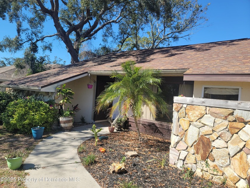 A modern style 3/2/2 home witha large screened in linai and - Beach Home for sale in Spring Hill, Florida on Beachhouse.com