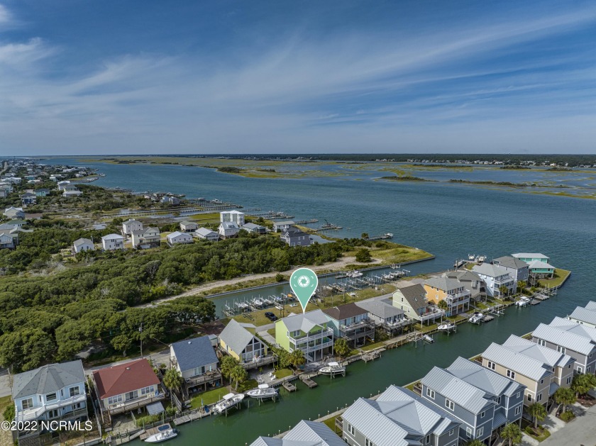 This immaculate, waterfront home boasts 4 bedrooms and 3 full - Beach Home for sale in Topsail Beach, North Carolina on Beachhouse.com