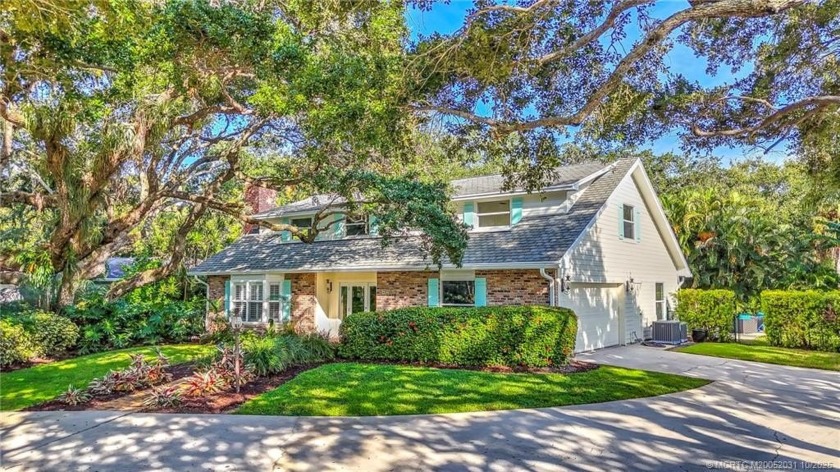 Nestled among centuries-old oaks in South Sewall's Point, this - Beach Home for sale in Sewalls Point, Florida on Beachhouse.com