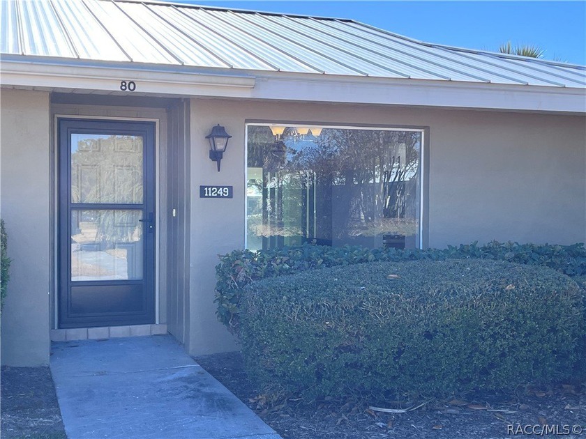 Open the sliding glass doors of your bright sunroom to view the - Beach Condo for sale in Crystal River, Florida on Beachhouse.com