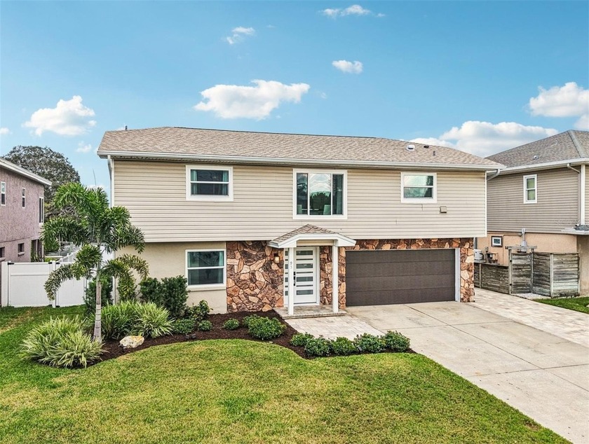 Welcome to 95 Eastwinds Court, an incredible WATERFRONT RETREAT - Beach Home for sale in Palm Harbor, Florida on Beachhouse.com