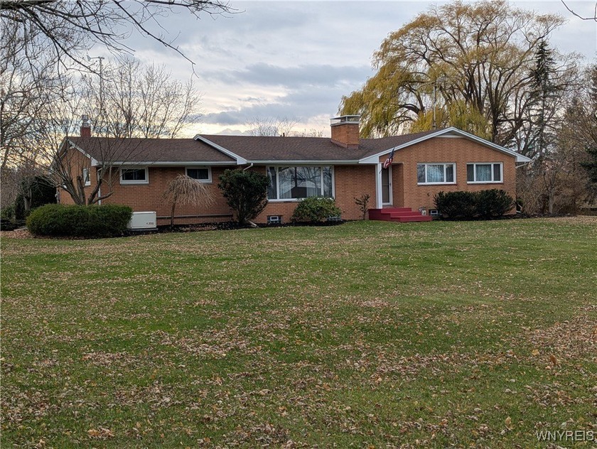 Welcome to 2000 Maple, a charming 4-bedroom, 2.5-bath brick - Beach Home for sale in Wilson, New York on Beachhouse.com