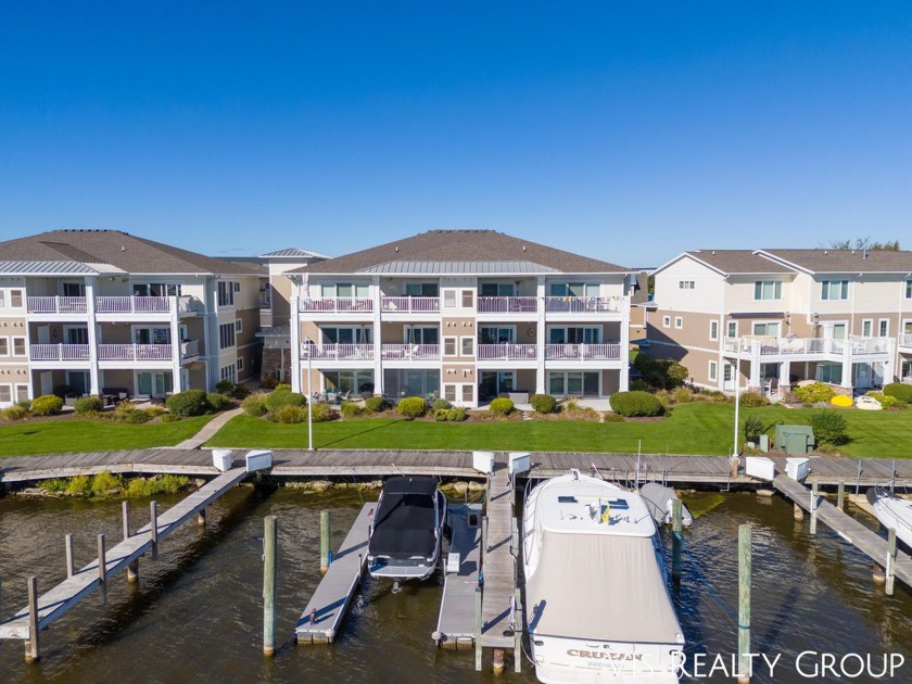 Experience breathtaking waterfront living with the convenience - Beach Condo for sale in Spring Lake, Michigan on Beachhouse.com